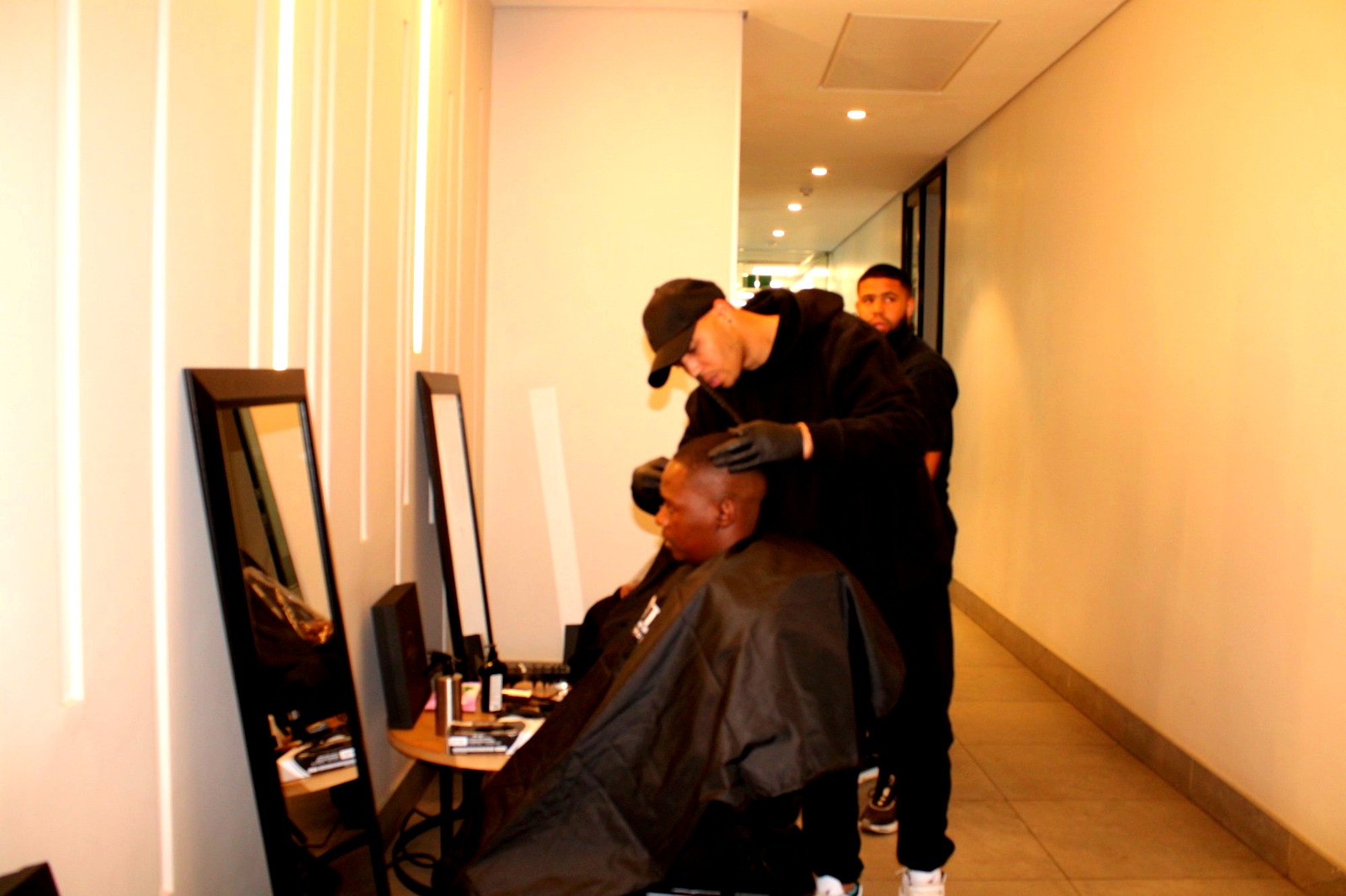 Two barbers working